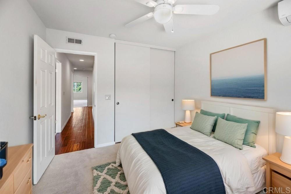 14040 Old Station Road Poway, CA 92064 - Photo 38 of 53 a bedroom with a bed and a mirror