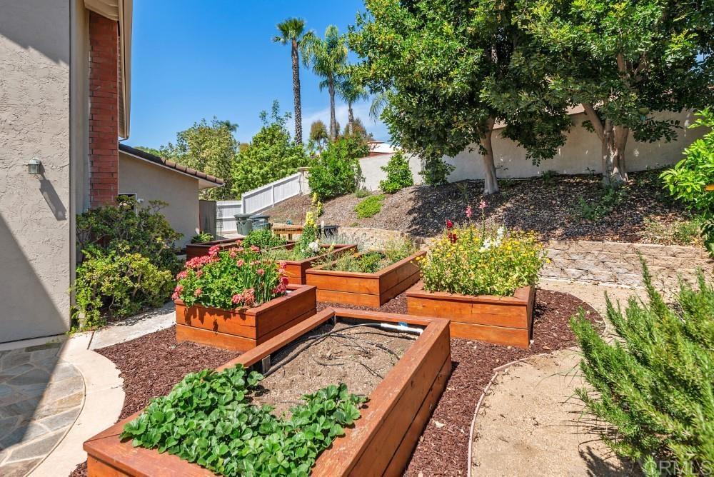 14040 Old Station Road Poway, CA 92064 - Photo 46 of 53 a view of a garden with wooden bench
