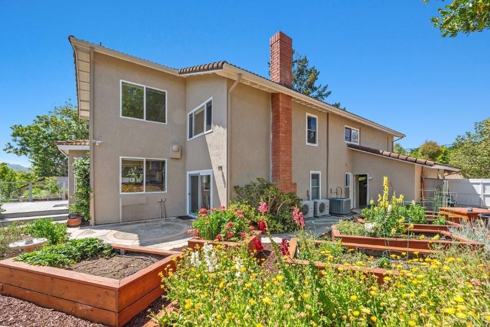 14040 Old Station Road Poway, CA 92064 - Photo 48 of 53 a front view of a house with garden