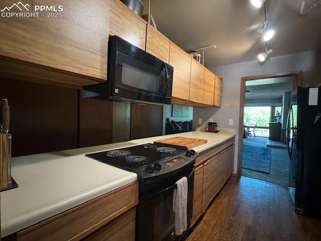 31 East Boulder Street Colorado Springs, CO 80903 - Photo 15 of 17 a kitchen with a stove and a microwave