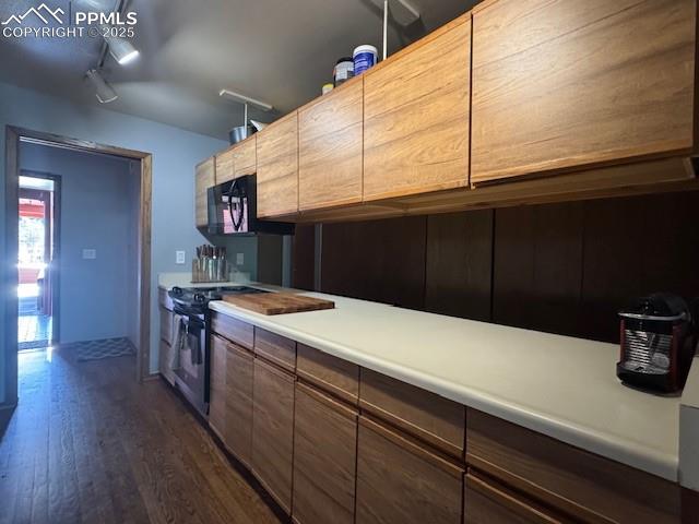 31 East Boulder Street Colorado Springs, CO 80903 - Photo 16 of 17 a kitchen with a sink and cabinets