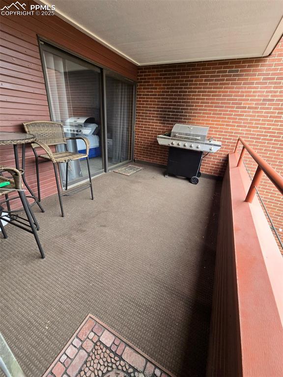 31 East Boulder Street Colorado Springs, CO 80903 - Photo 17 of 17 a balcony with furniture and window