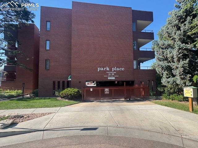 31 East Boulder Street Colorado Springs, CO 80903 - Photo 2 of 17 a front view of a house with a yard