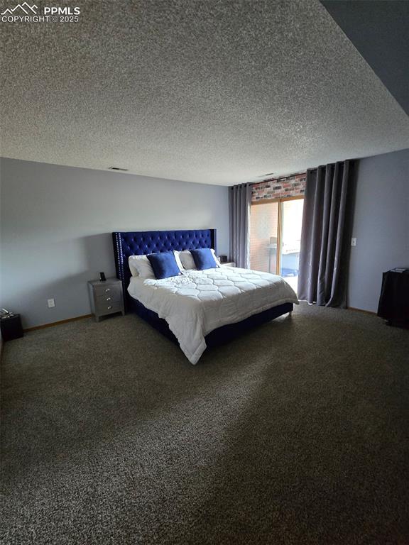 31 East Boulder Street Colorado Springs, CO 80903 - Photo 8 of 17 a bedroom with a bed and window