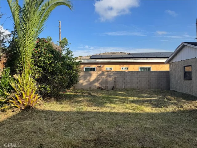 a view of yard with swimming pool