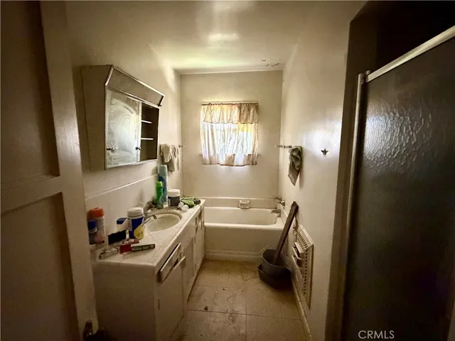 a room with a sink furniture and a window