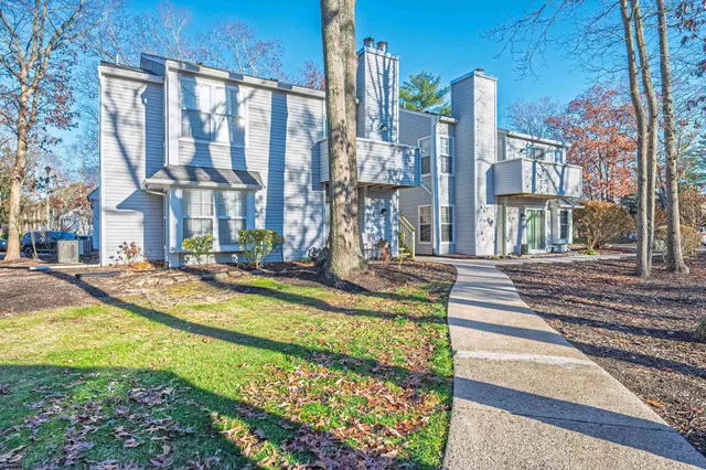 a view of an apartment with a swimming pool