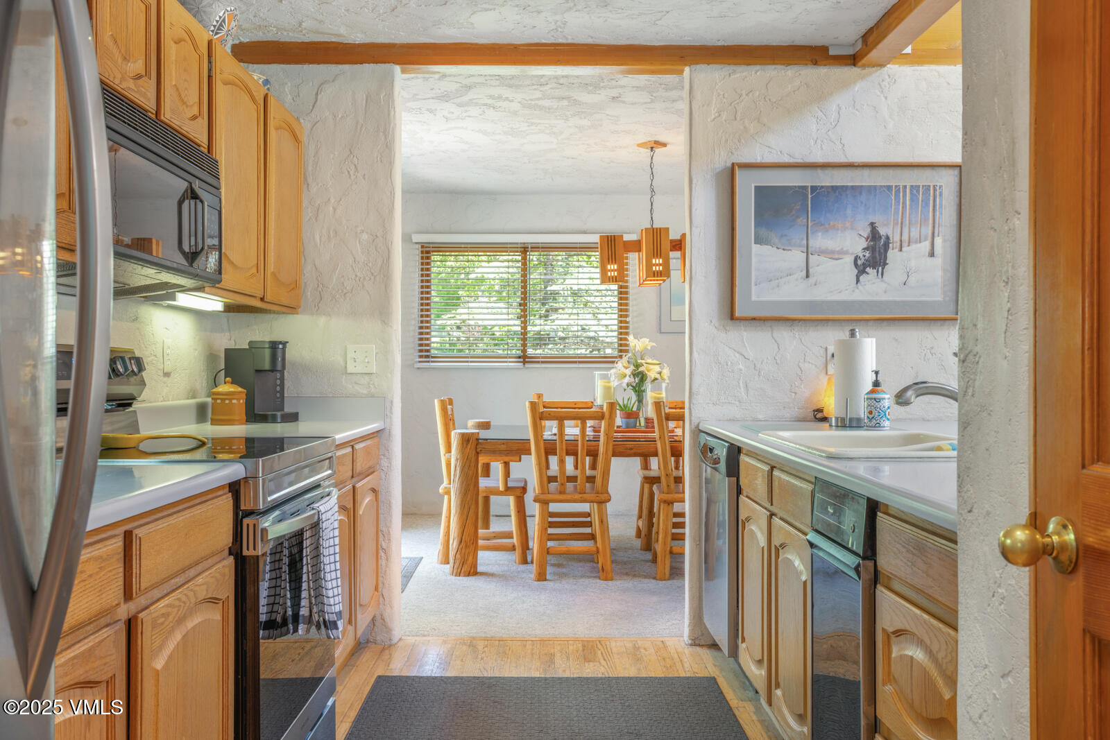 20 Hereford Road Edwards, CO 81632 - Photo 7 of 32 a kitchen with stainless steel appliances granite countertop a stove a sink and a refrigerator