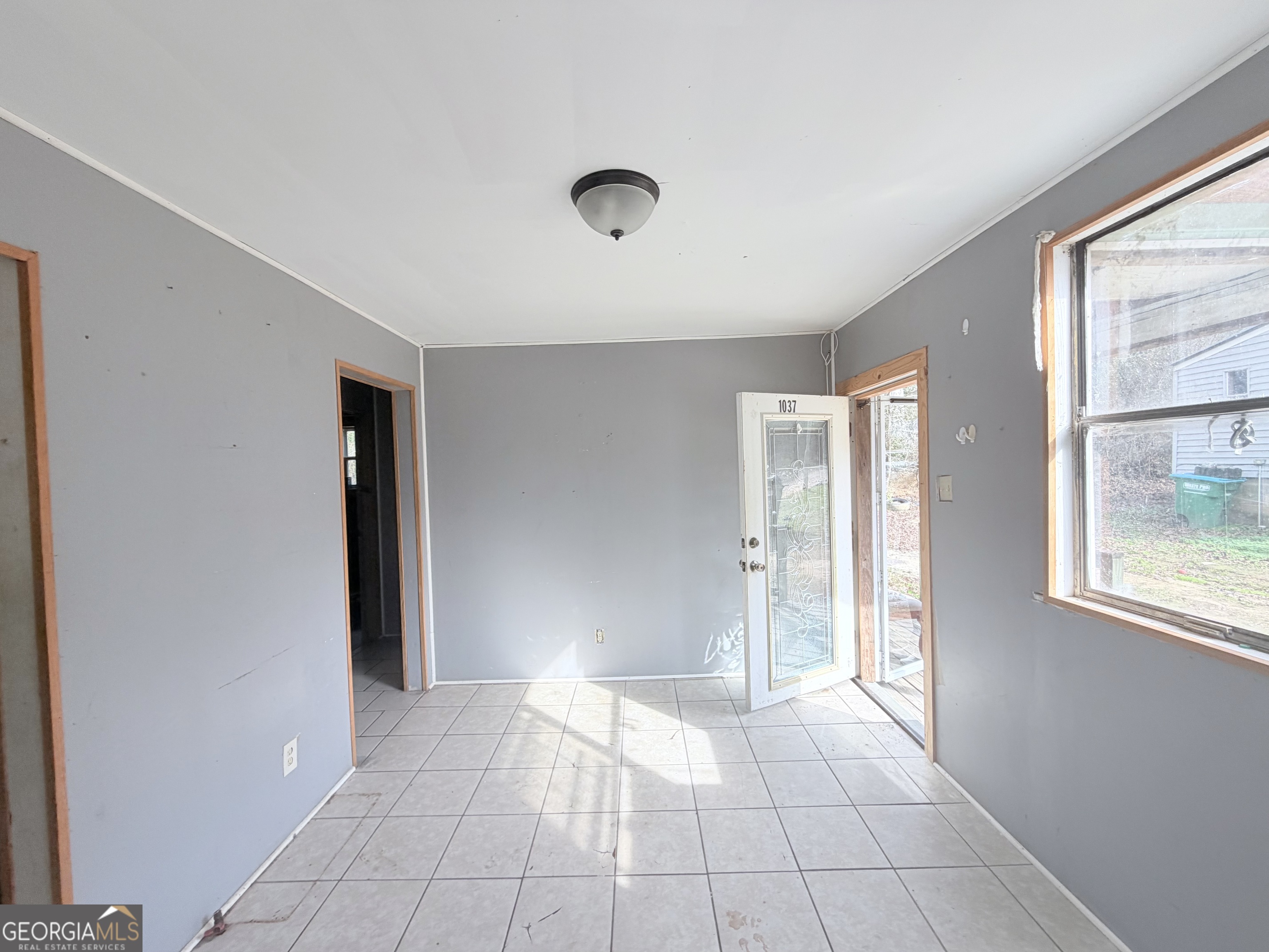 1037 Campbell St Extension Elberton, GA 30635 - Photo 2 of 7 a view of an empty room and window