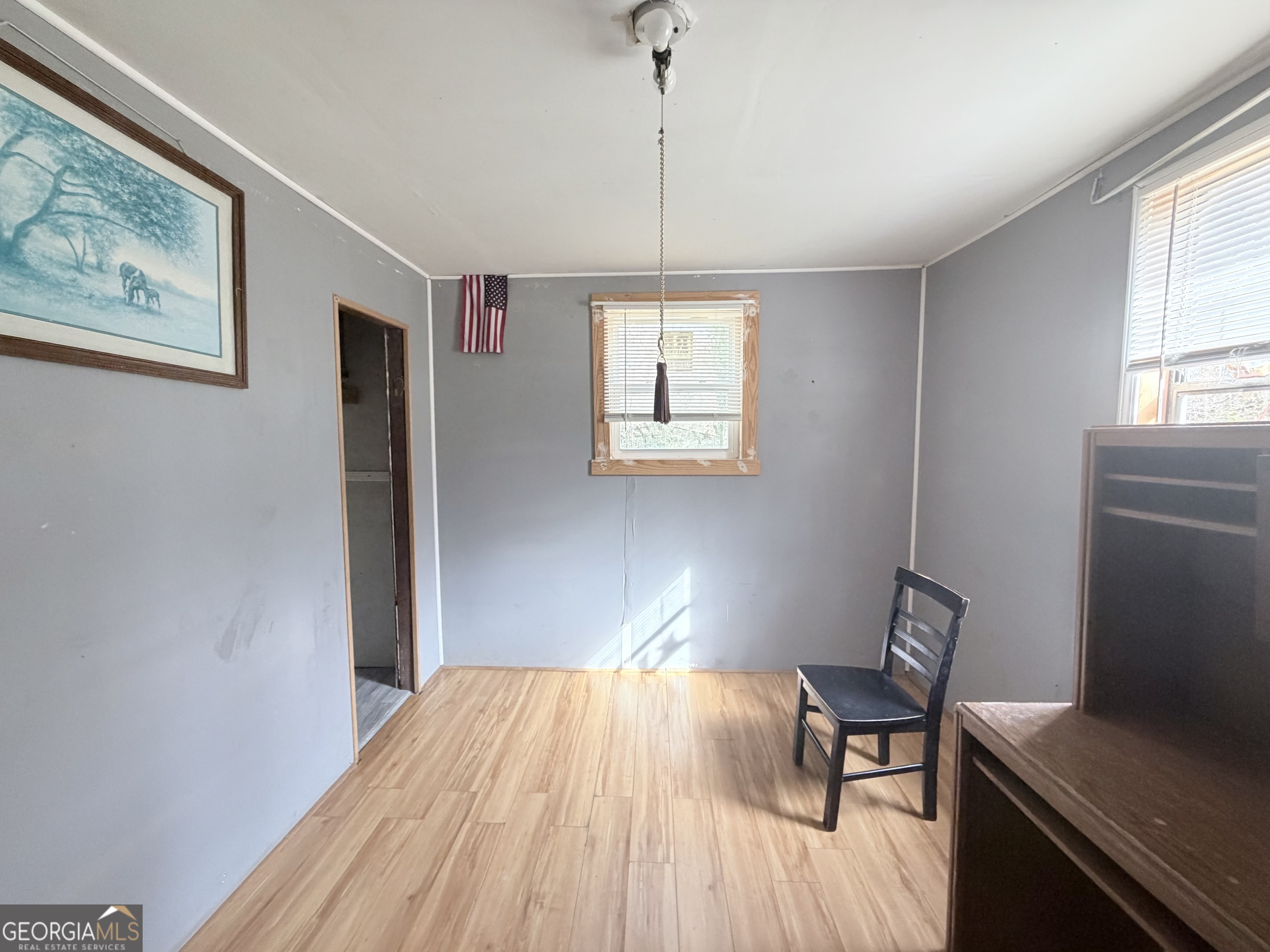 1037 Campbell St Extension Elberton, GA 30635 - Photo 3 of 7 a bedroom with a bed and a table