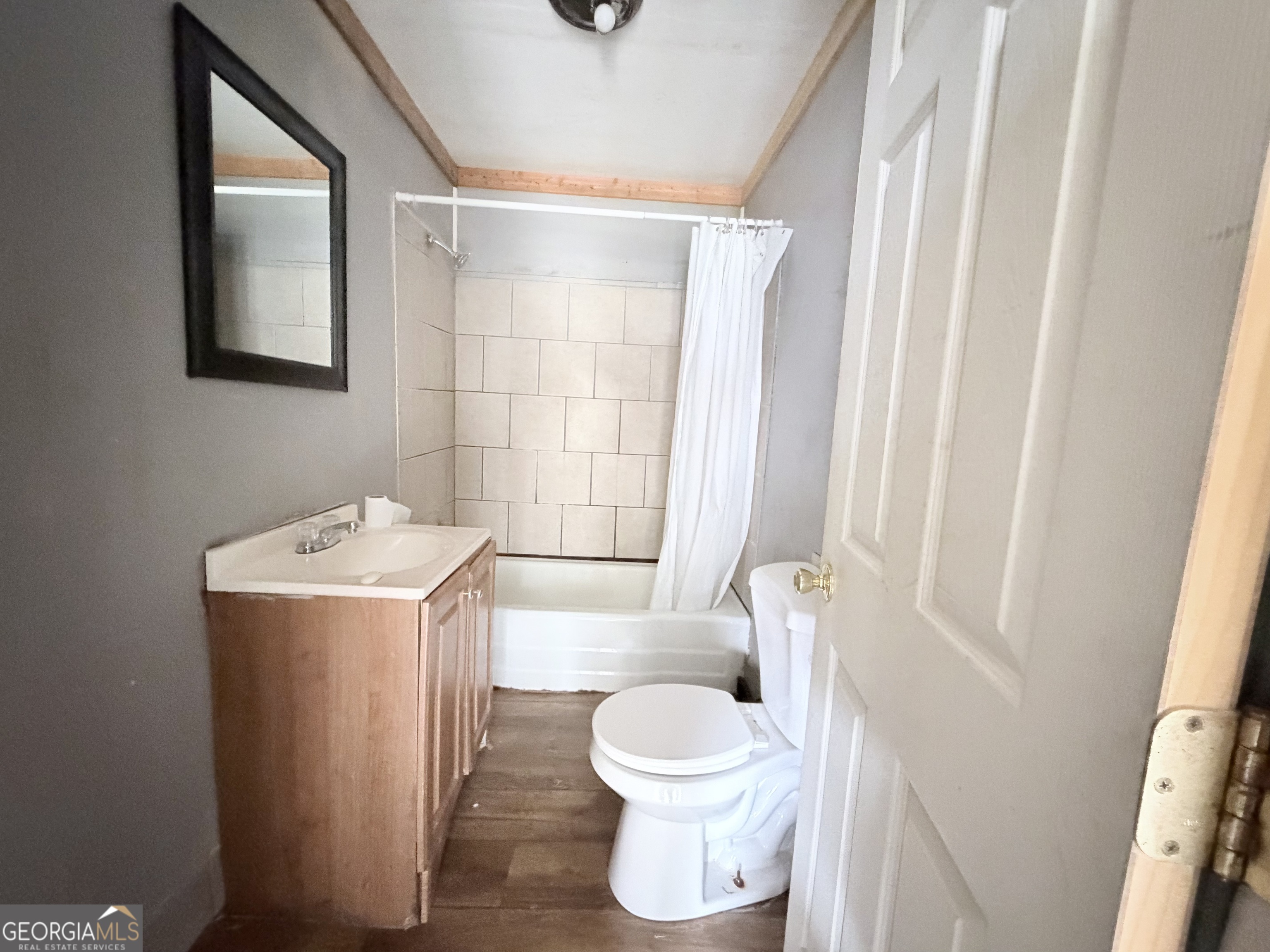1037 Campbell St Extension Elberton, GA 30635 - Photo 4 of 7 a bathroom with a sink toilet and shower