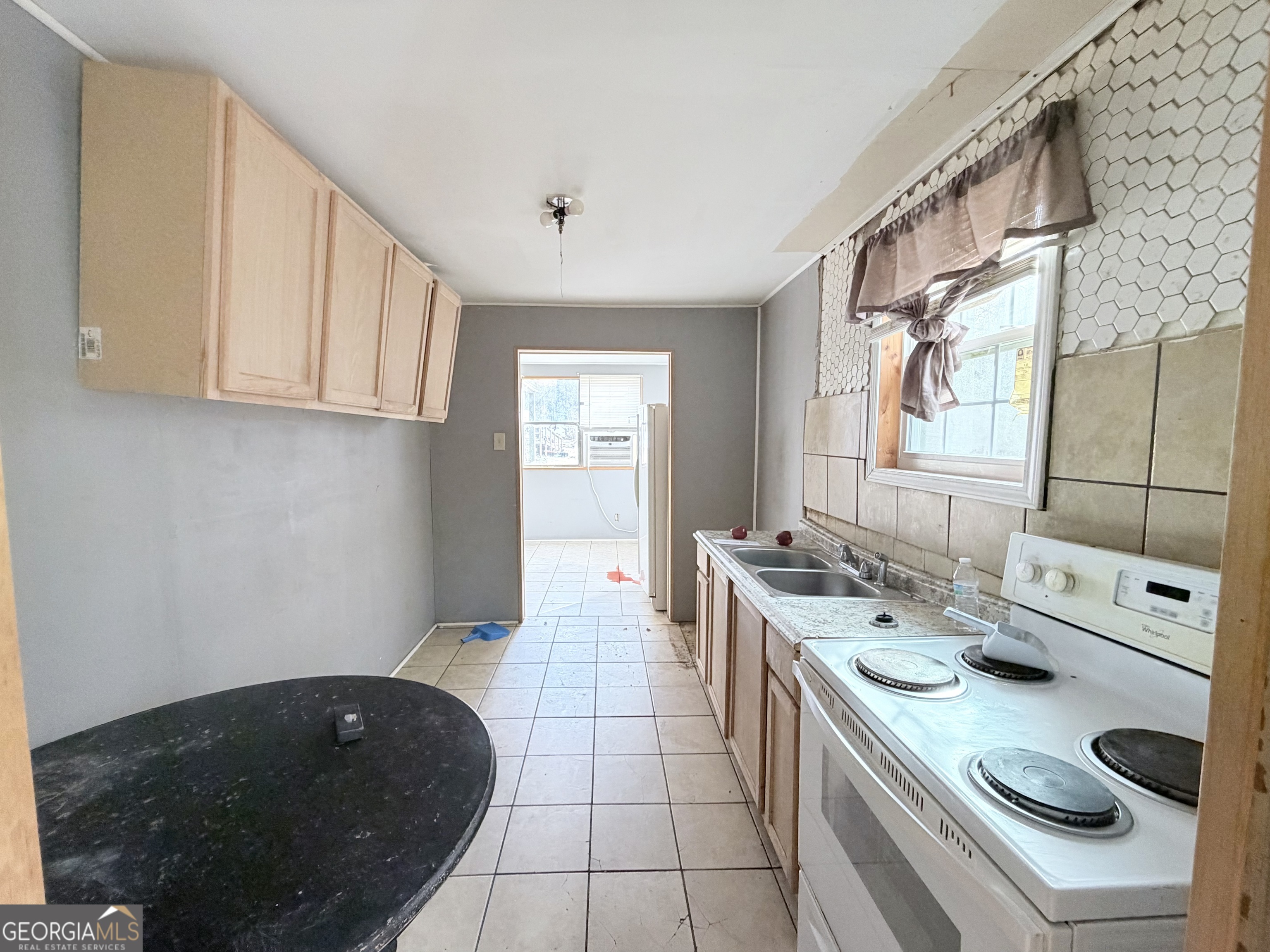 1037 Campbell St Extension Elberton, GA 30635 - Photo 5 of 7 a kitchen with a sink stove and cabinets
