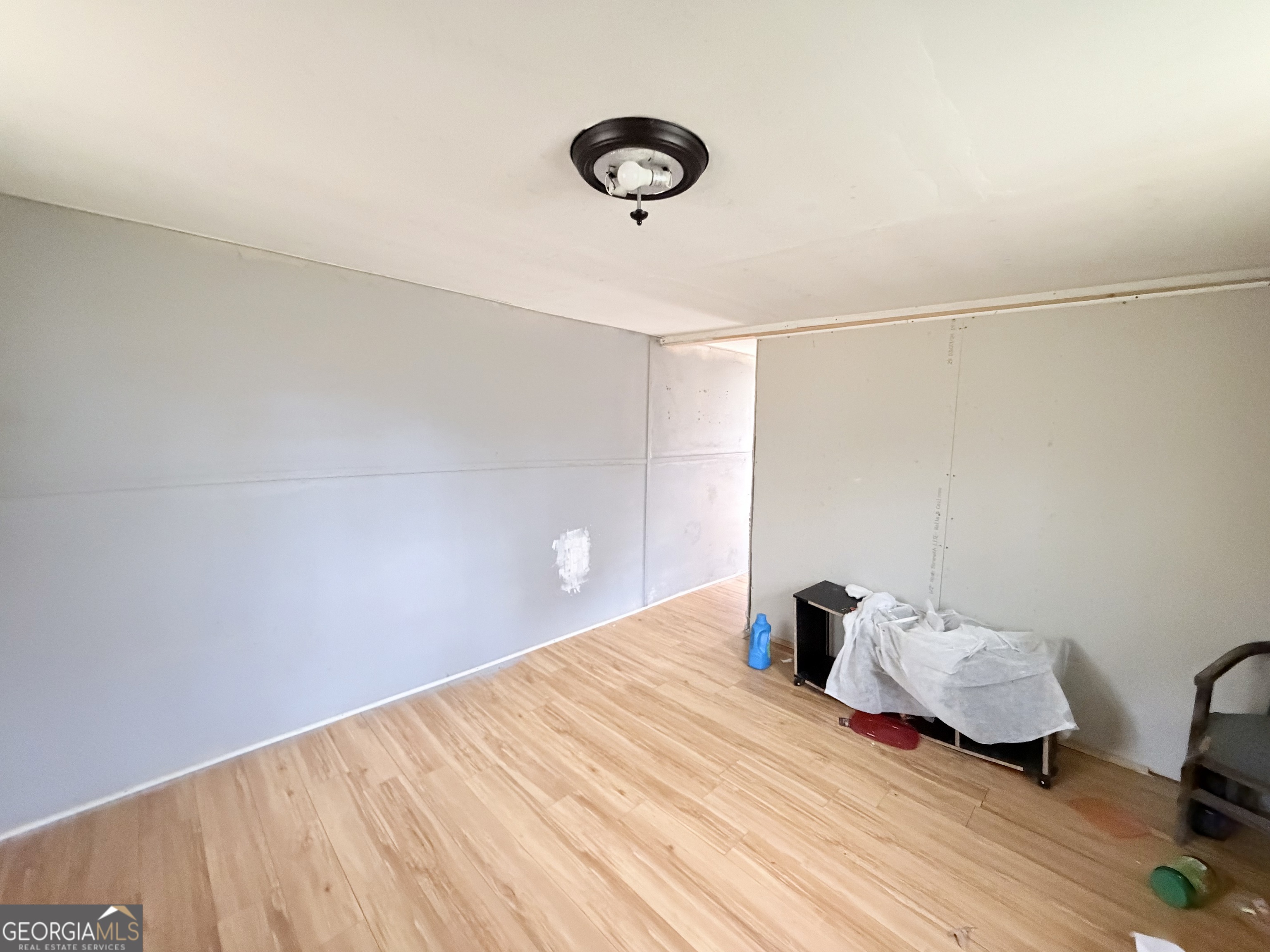 1037 Campbell St Extension Elberton, GA 30635 - Photo 7 of 7 a bedroom with a bed and a chandelier