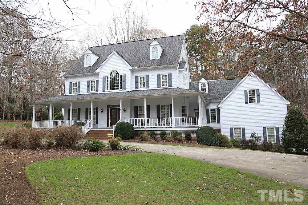 Wonderful setting with circular drive, wrap around porch, 3 car garage!