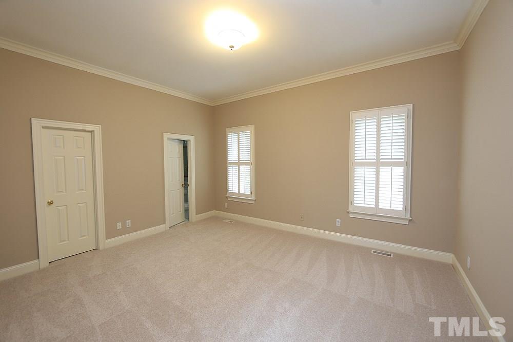 8617 Cold Springs Road Raleigh, NC 27615 - Photo 11 of 30 There is a full bath and a large walk in closet in this guest suite.