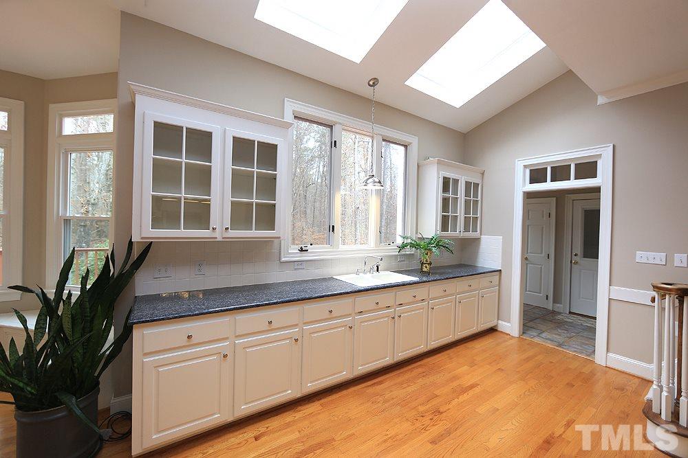 8617 Cold Springs Road Raleigh, NC 27615 - Photo 15 of 30 So many cabinets in this highly efficient kitchen.