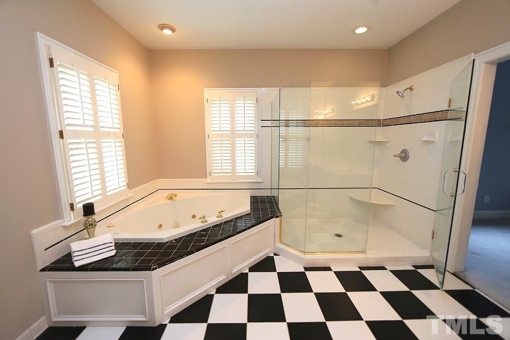 8617 Cold Springs Road Raleigh, NC 27615 - Photo 20 of 30 There is a large room with both generous tub and shower, dual sinks.