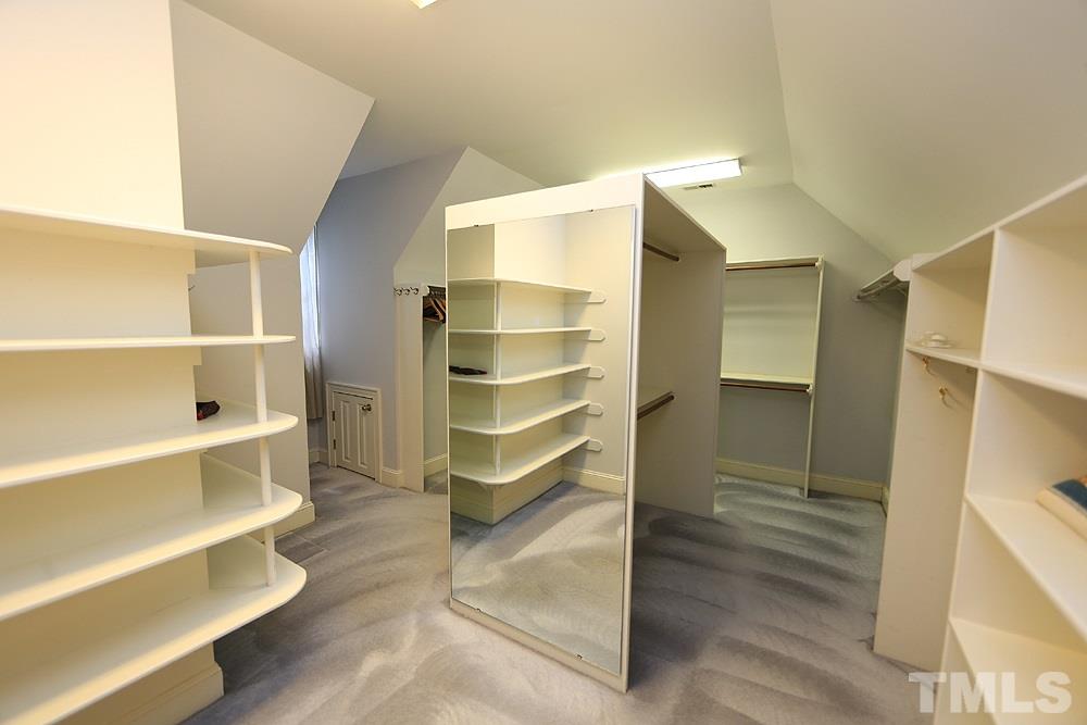 8617 Cold Springs Road Raleigh, NC 27615 - Photo 21 of 30 This closet is really large, well designed and has storage in the eaves.
