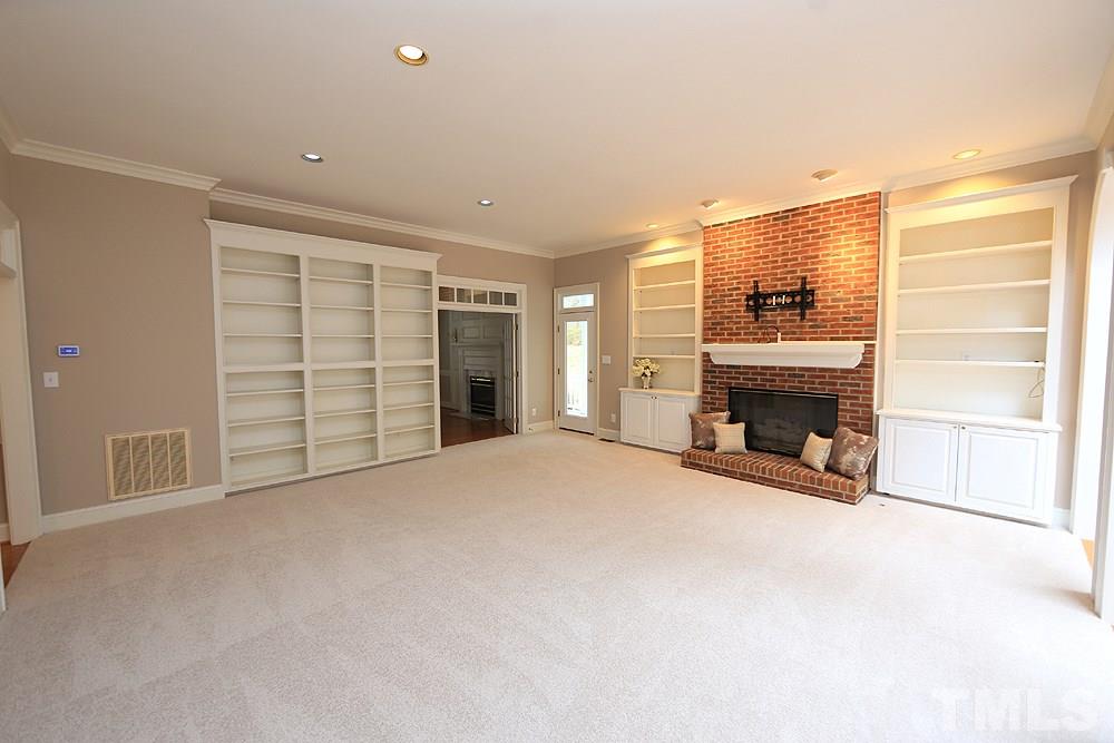 8617 Cold Springs Road Raleigh, NC 27615 - Photo 8 of 30 Enjoy the fireplace while you are relaxing.