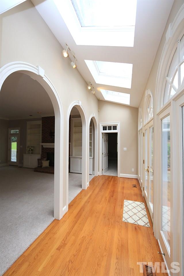 8617 Cold Springs Road Raleigh, NC 27615 - Photo 10 of 30 This hallway leads to the 1st floor guest suite.