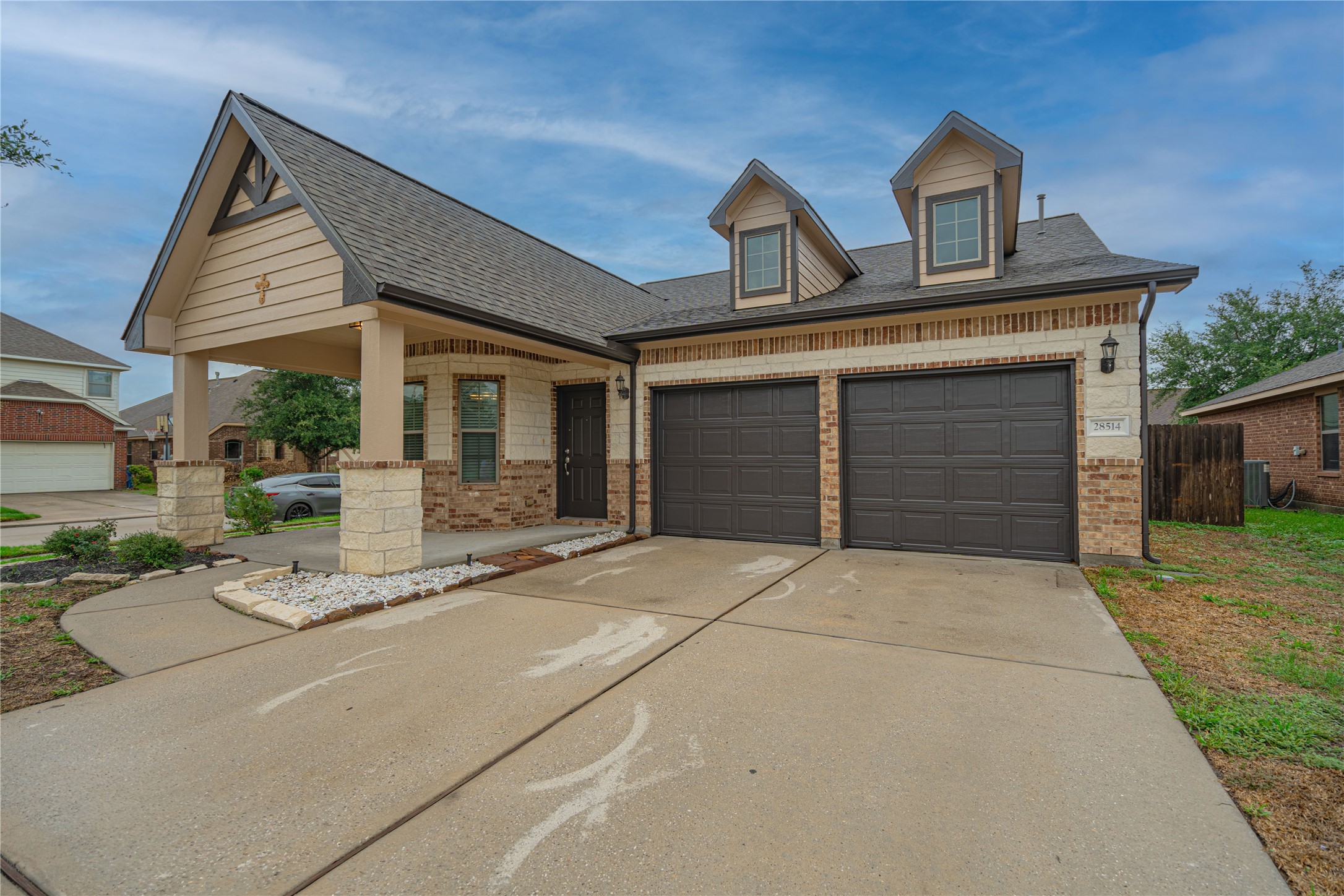 a front view of a house with garden
