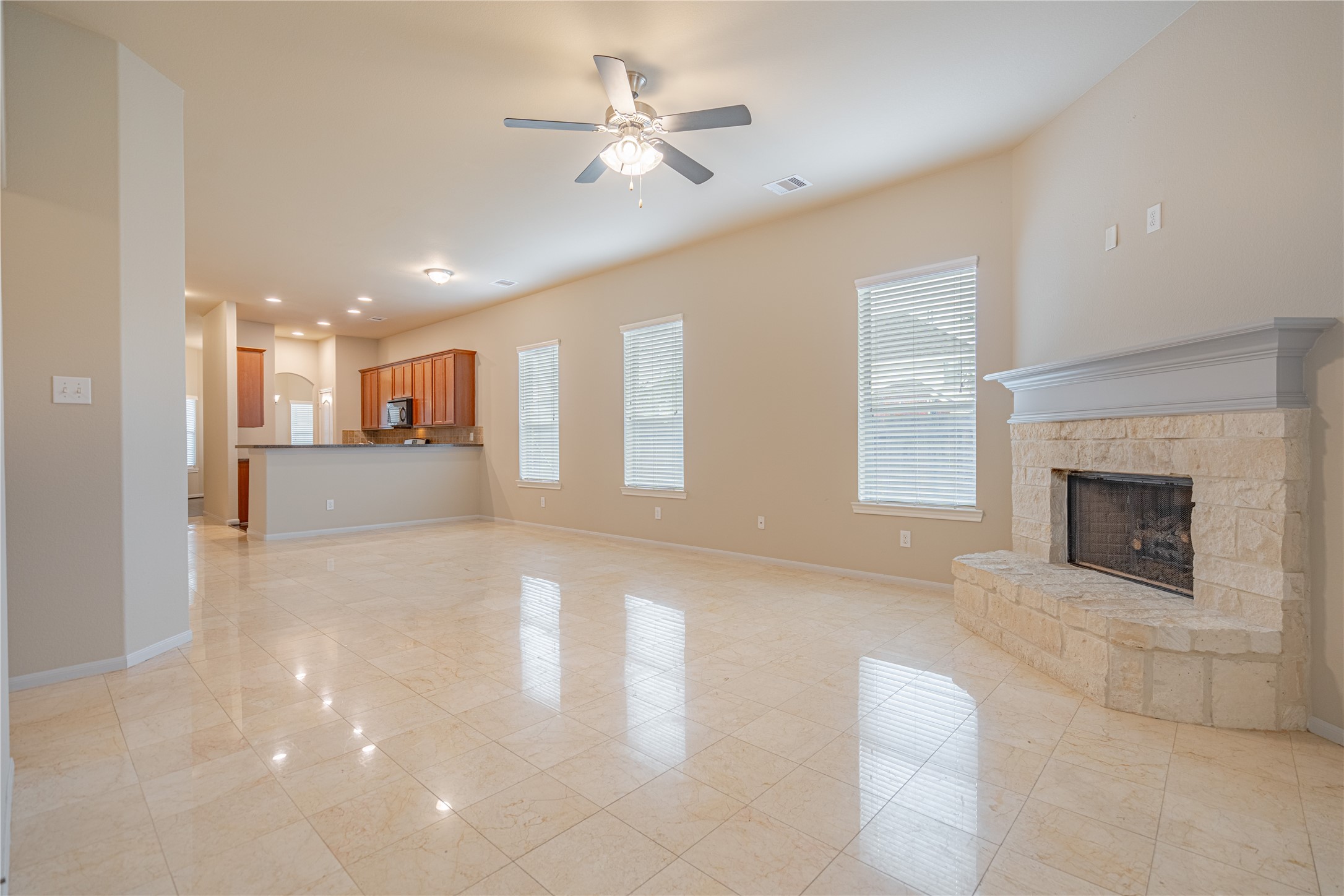 28514 Lockeridge Springs Drive Spring, TX 77386 - Photo 15 of 35 a view of an empty room with a fireplace and a window