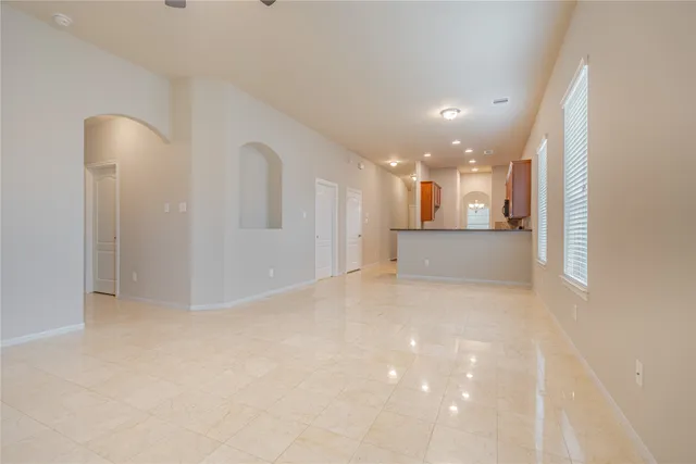 a view of a big room with a kitchen