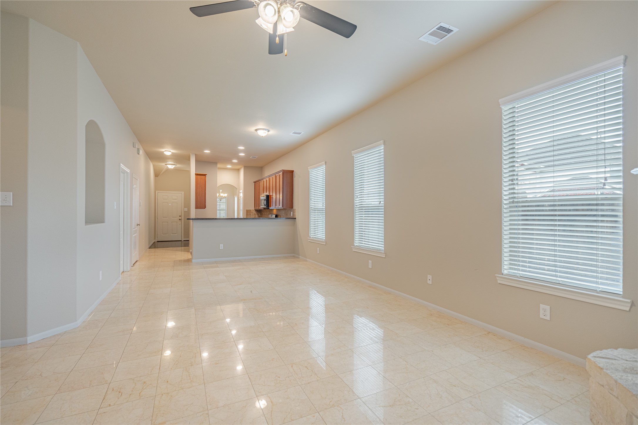 28514 Lockeridge Springs Drive Spring, TX 77386 - Photo 18 of 35 a view of a big room with windows and chandelier fan
