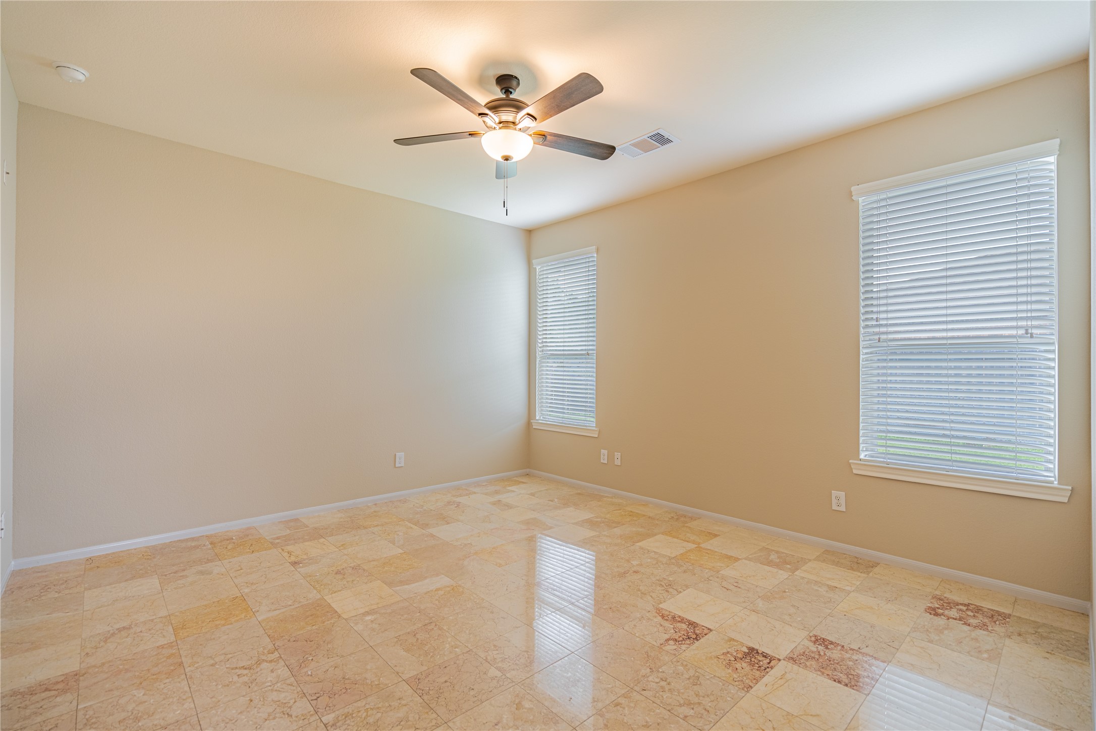 28514 Lockeridge Springs Drive Spring, TX 77386 - Photo 19 of 35 an empty room with a window and a fan