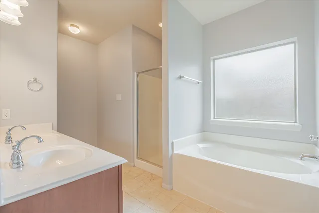 a bathroom with a bathtub and a sink