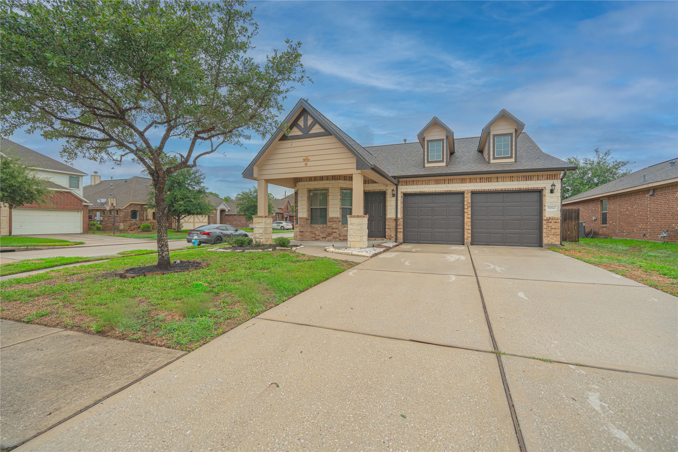 28514 Lockeridge Springs Drive Spring, TX 77386 - Photo 3 of 35 a front view of a house with garden