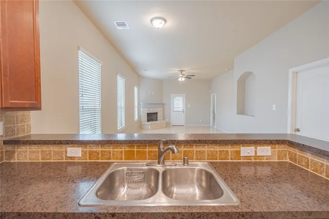 a close view of a sink and a table in a kitchen
