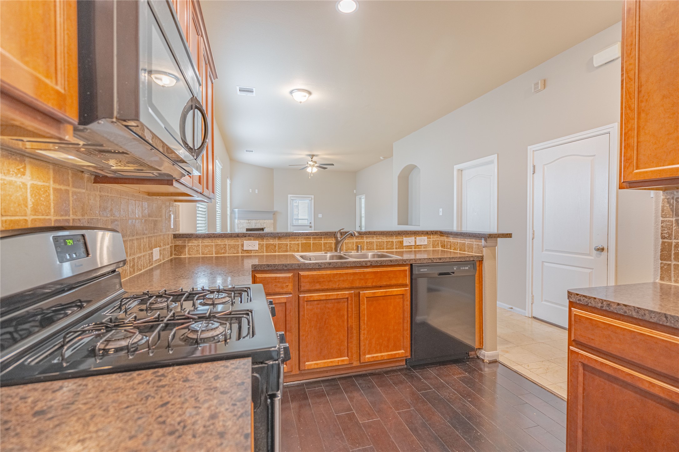 28514 Lockeridge Springs Drive Spring, TX 77386 - Photo 9 of 35 a kitchen with stainless steel appliances granite countertop a stove and a sink