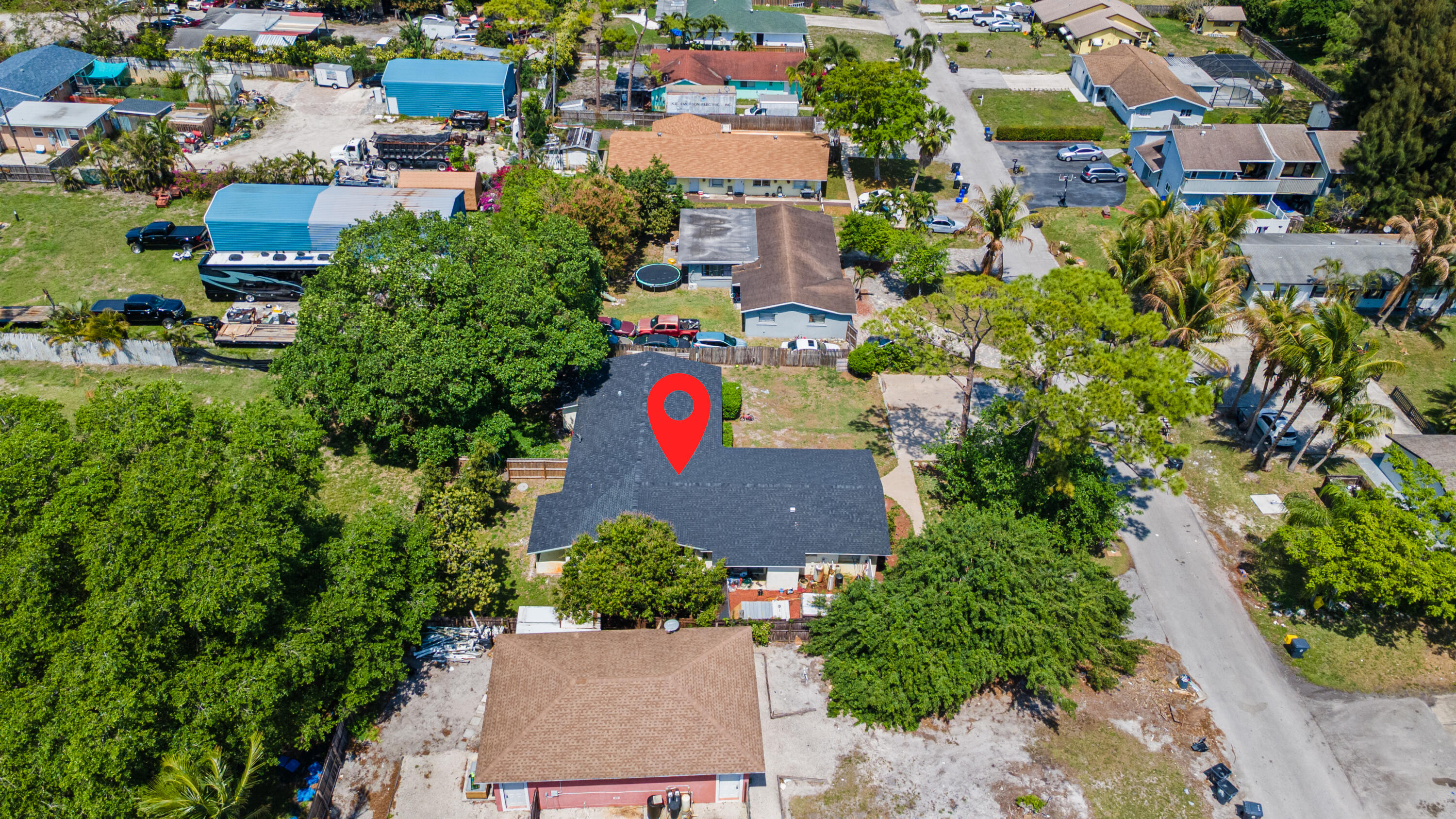 4453 Stevens Road Lake Worth Beach, FL 33461 - Photo 10 of 67 an aerial view of residential houses with outdoor space and trees all around