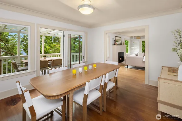 a dining room with furniture and wooden floor