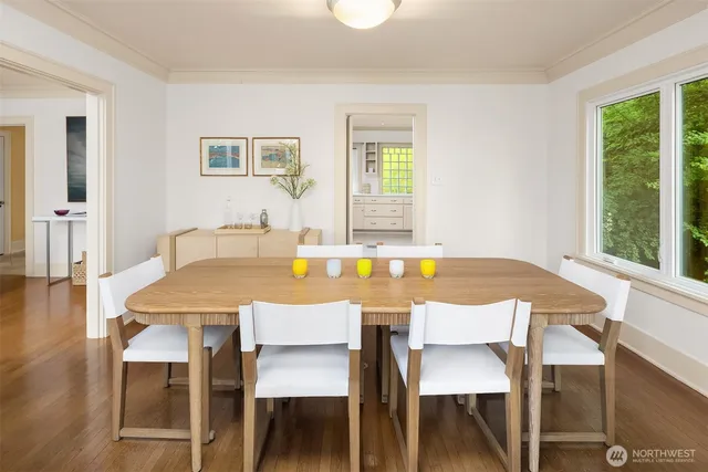 a view of a dining room with furniture and wooden floor