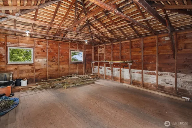 a view of an empty room with windows