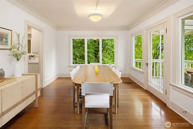 a view of a dining room with furniture window and wooden floor