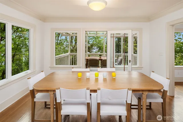 a view of a dining room with furniture and window