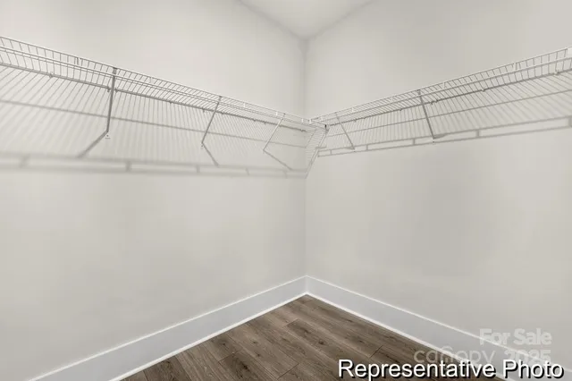 a bathroom with a double vanity sink toilet and shower