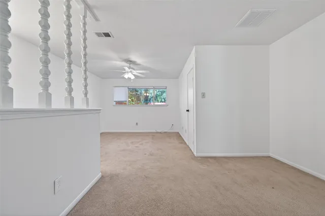 an view of an empty room with a window
