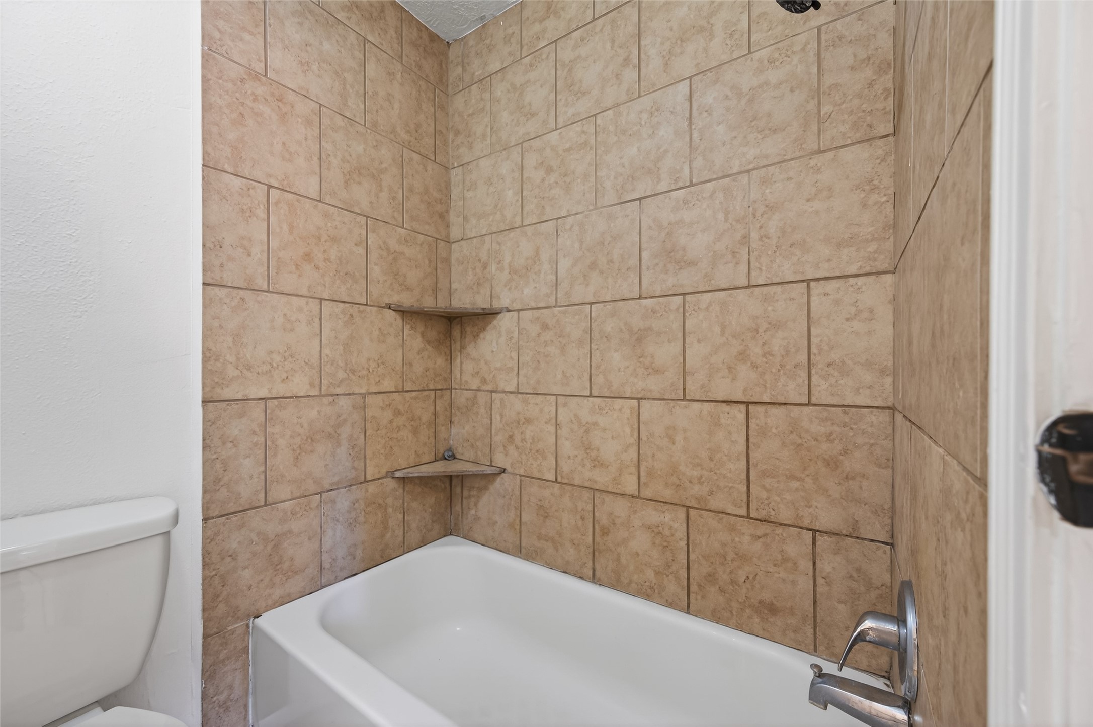 2603 Shady Bayou Lane Spring, TX 77373 - Photo 25 of 43 a bathroom with a bathtub