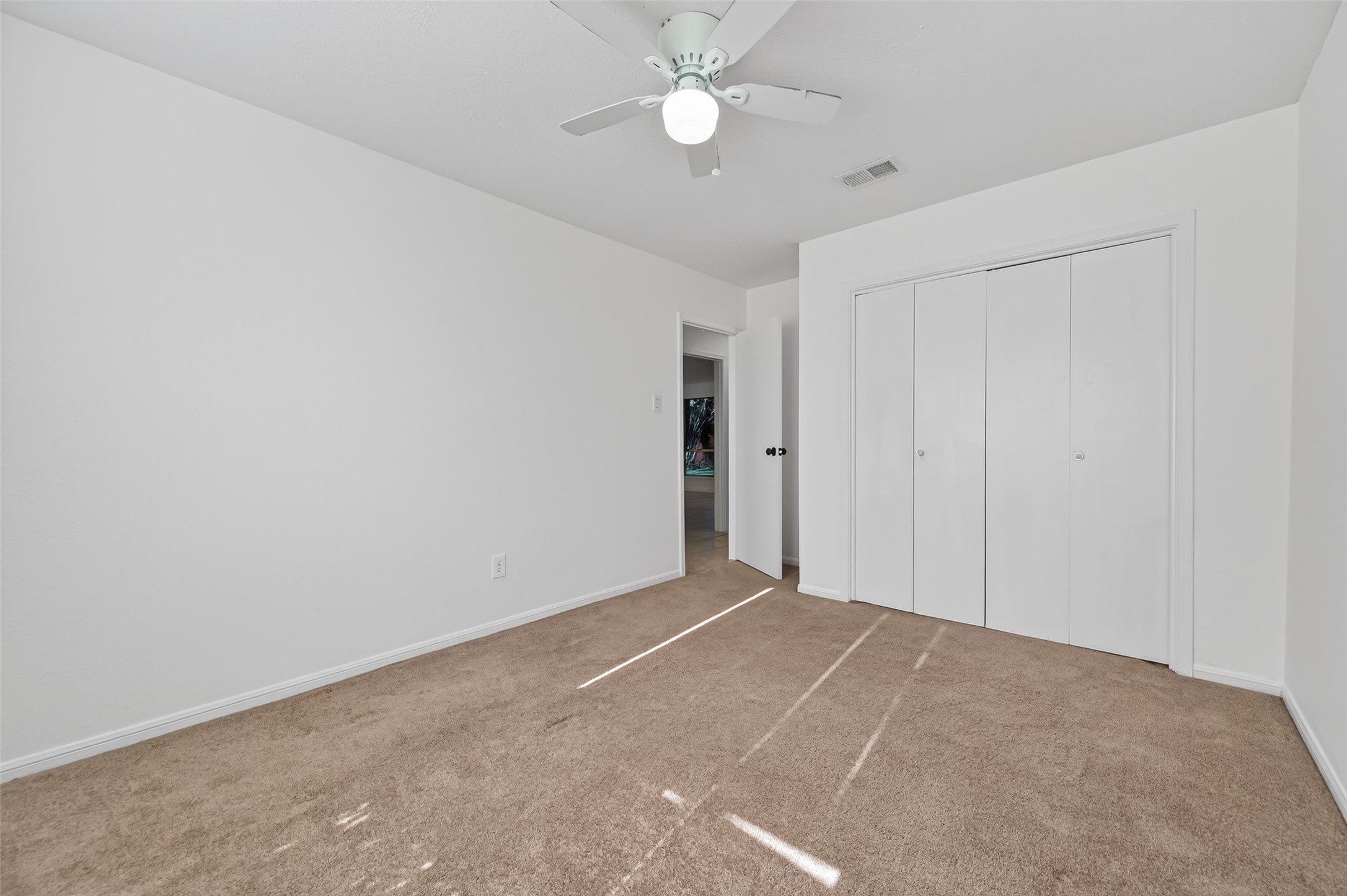 2603 Shady Bayou Lane Spring, TX 77373 - Photo 30 of 43 a view of an empty room with a ceiling fan