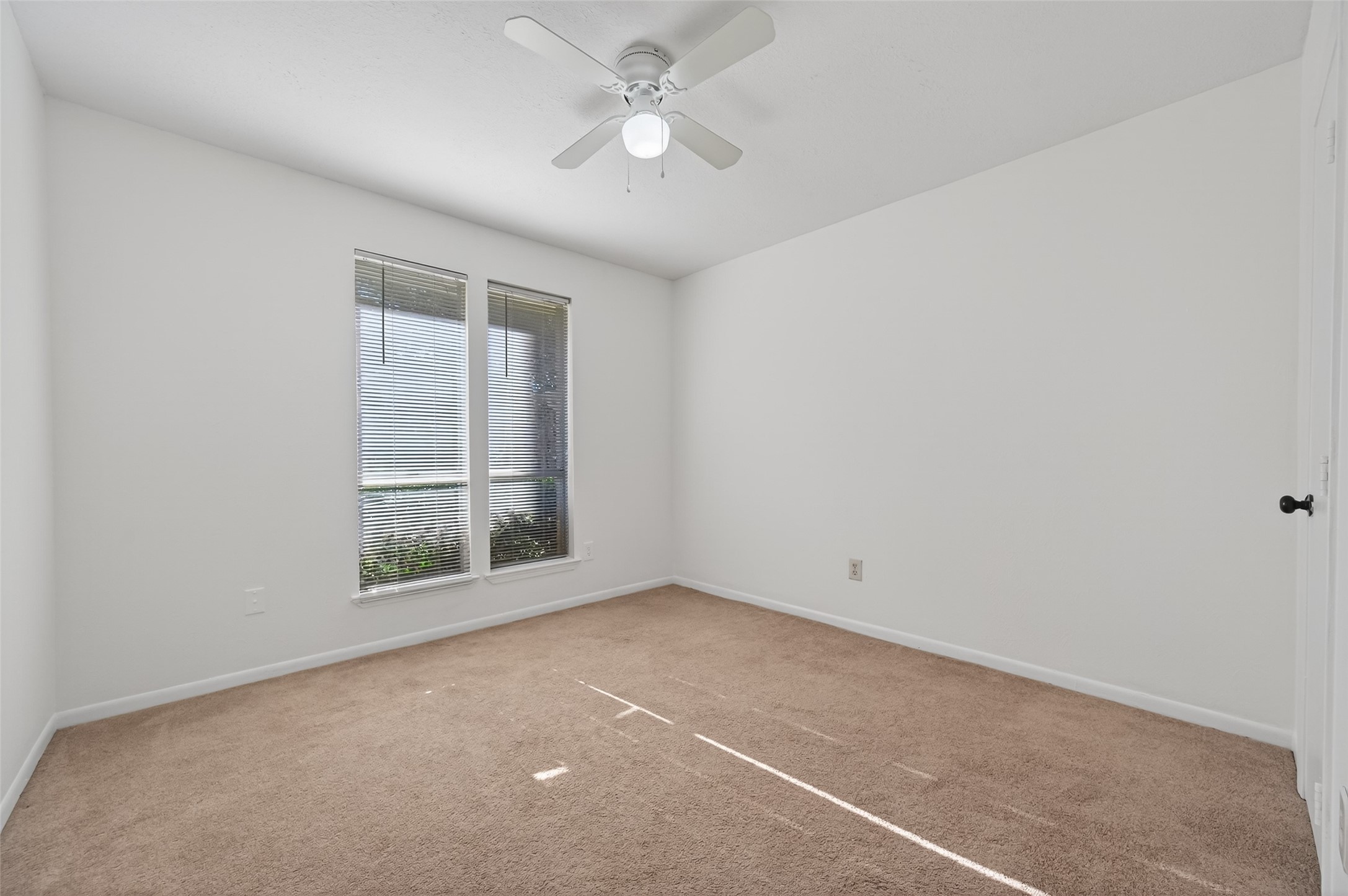 2603 Shady Bayou Lane Spring, TX 77373 - Photo 31 of 43 an empty room with a window and a fan
