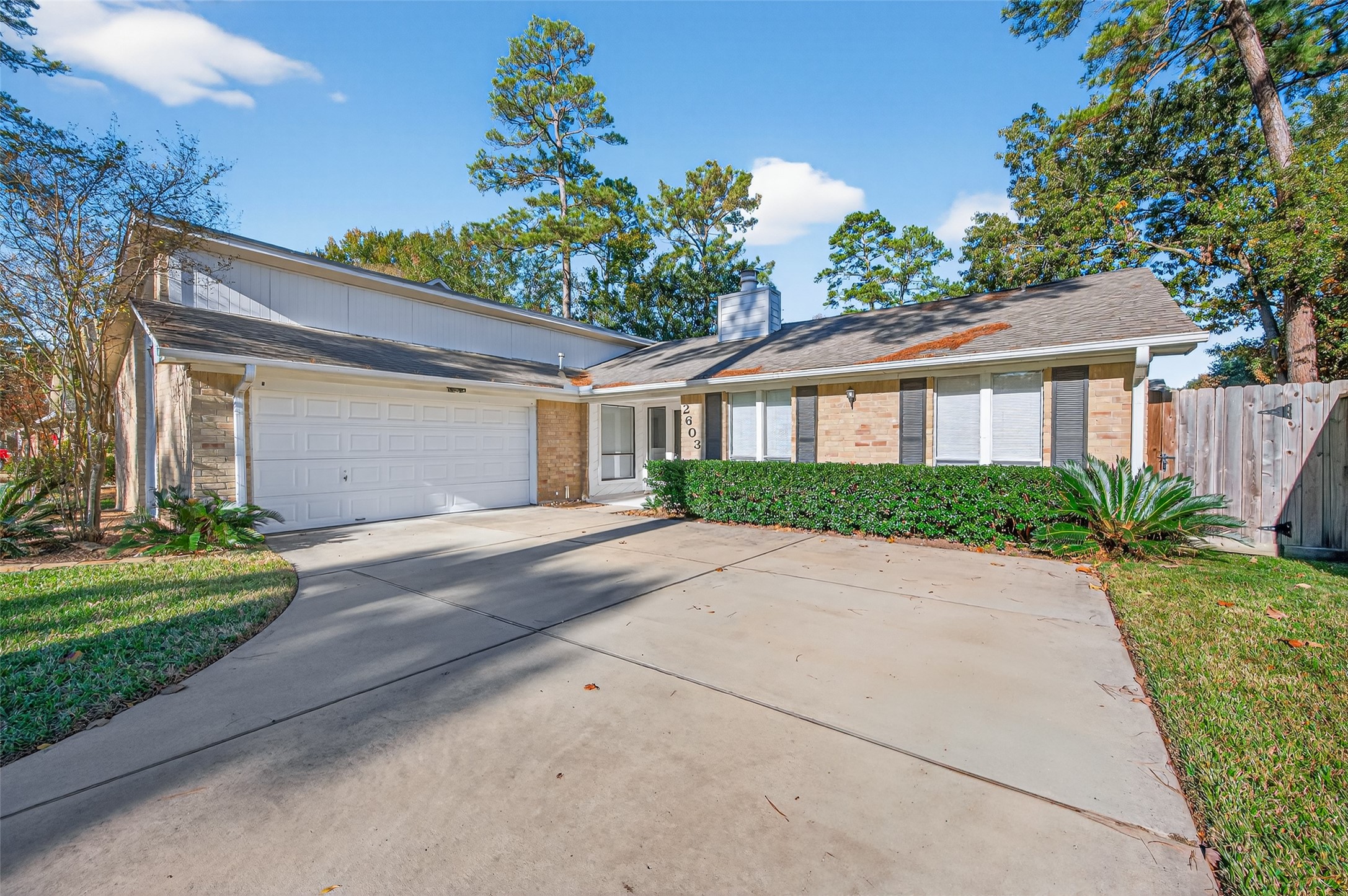 2603 Shady Bayou Lane Spring, TX 77373 - Photo 6 of 43 a front view of a house with a yard and a garage