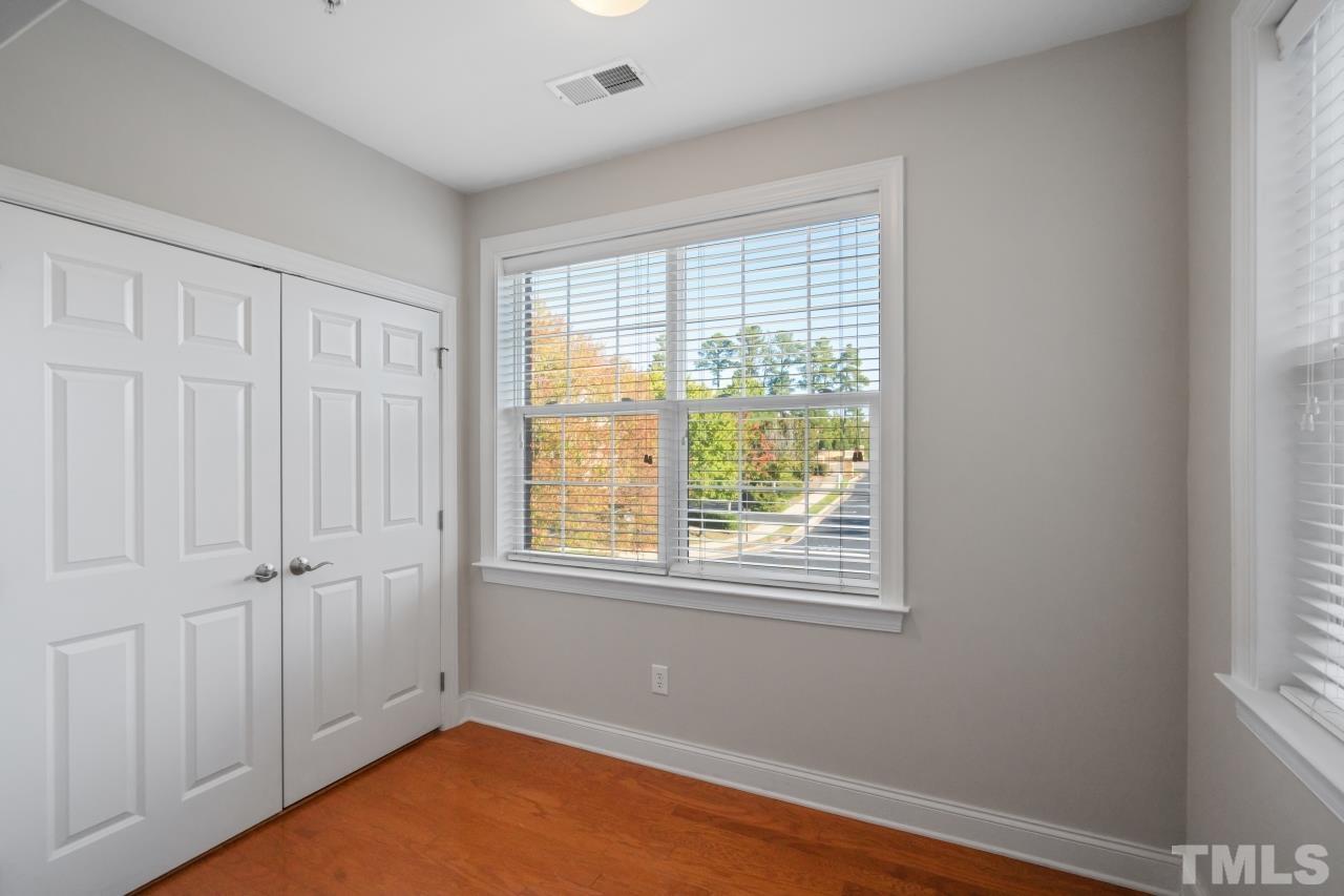 10421 Rosegate Court, Unit 201 Raleigh, NC 27617 - Photo 6 of 12 an empty room with a window