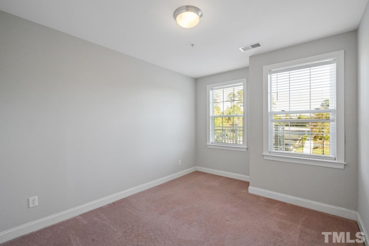 10421 Rosegate Court, Unit 201 Raleigh, NC 27617 - Photo 7 of 12 an empty room with a window