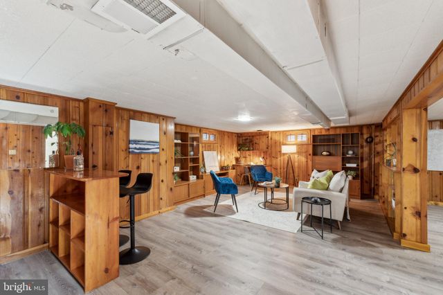 a living room with lots of furniture and a flat screen tv