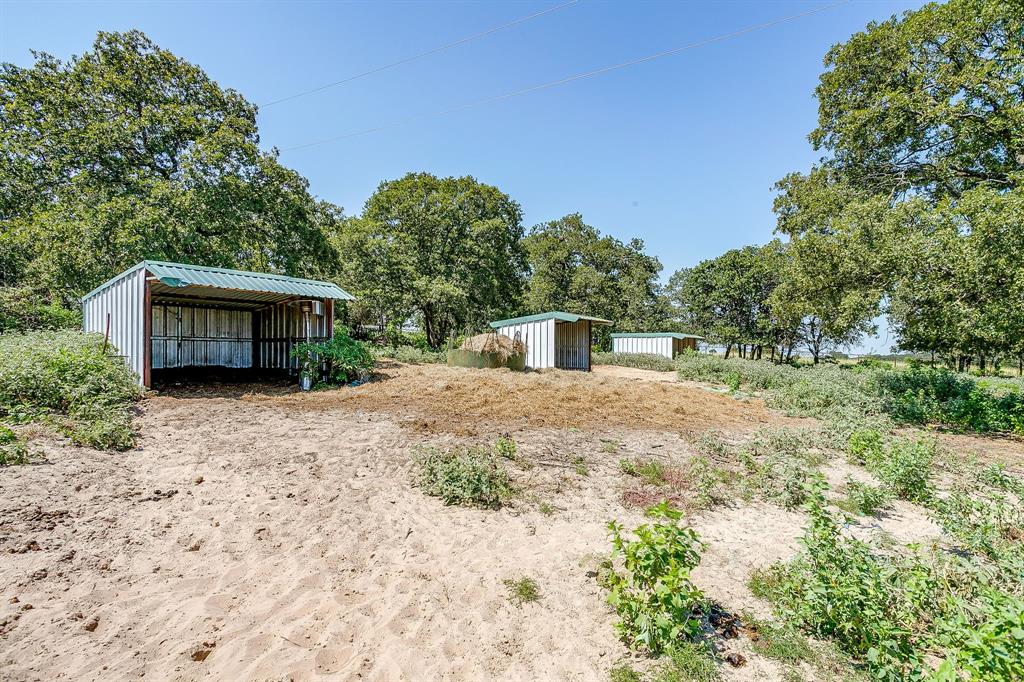 7726 West Highway 199 Springtown, TX 76082 - Photo 28 of 29 a house view with a sink and yard