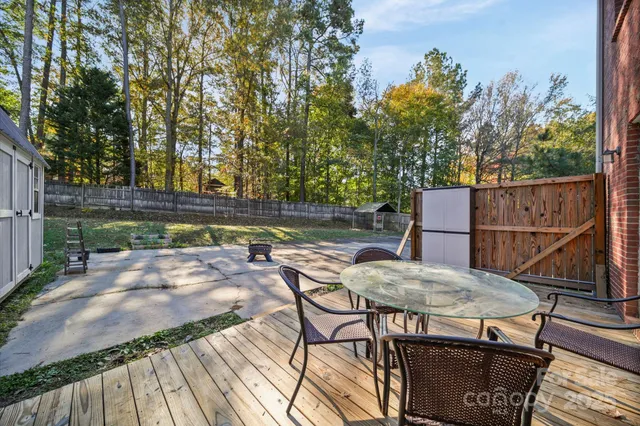 a view of a backyard with sitting area